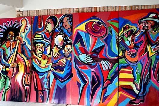 Colorful whimsical mural on panels by Corey Barksdale, Carrollton, Georgia