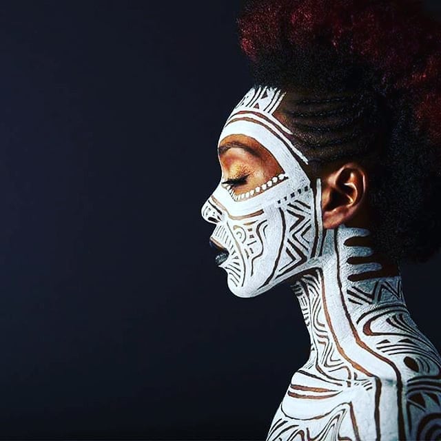 High-contrast traditional African tribal face paint design