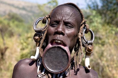 Large traditional African lip disk body modification