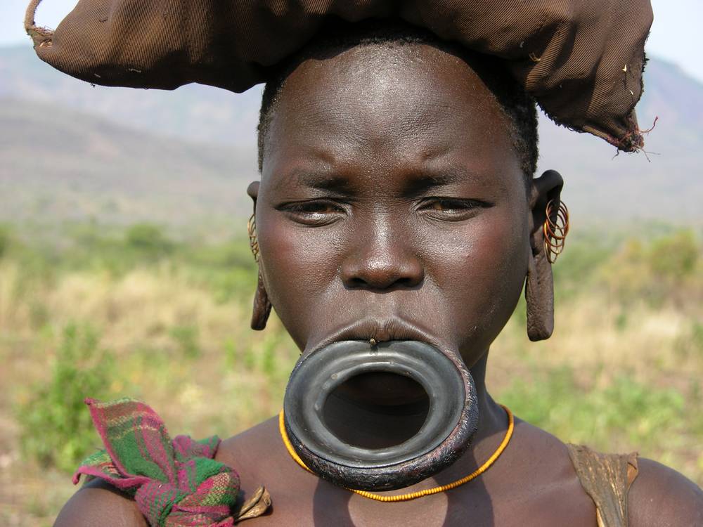 Mursi tribe traditional lip plate modification