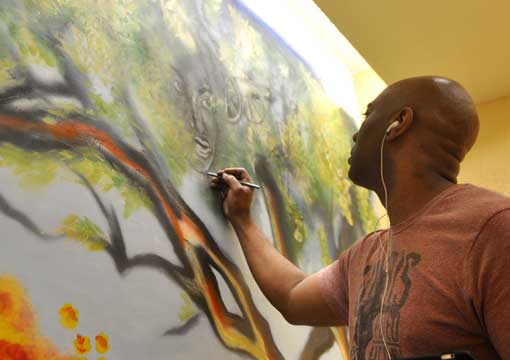 Atlanta artist Corey Barksdale mural painting, Georgia