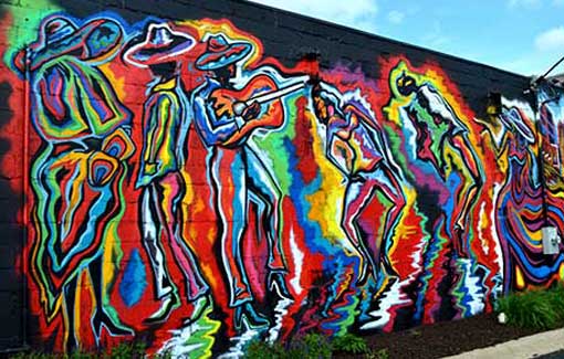 American muralist Corey Barksdale painting for the Rockford, Illinois CRE8IV mural festival