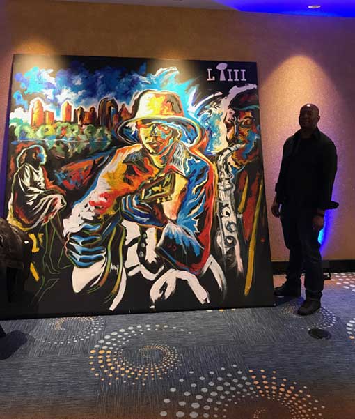 Live painting by Corey Barksdale at the Georgia Aquarium during Super Bowl LIII